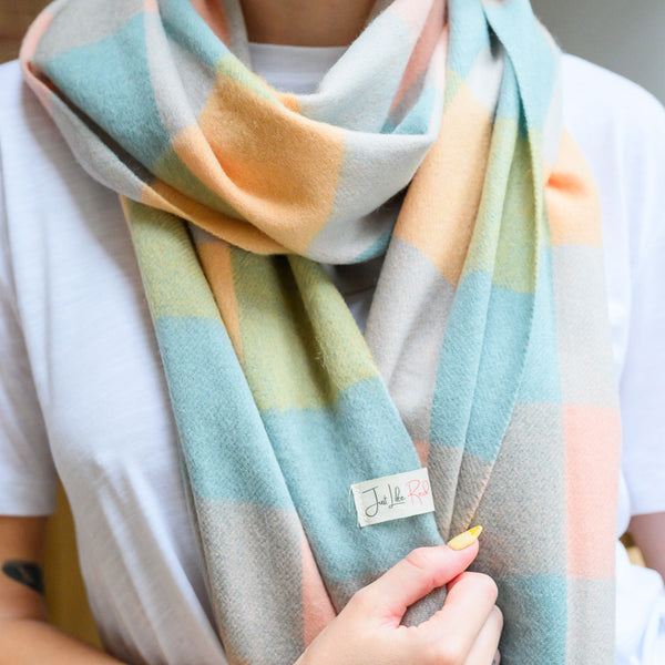 Woman wearing pastel mint gingham scarf